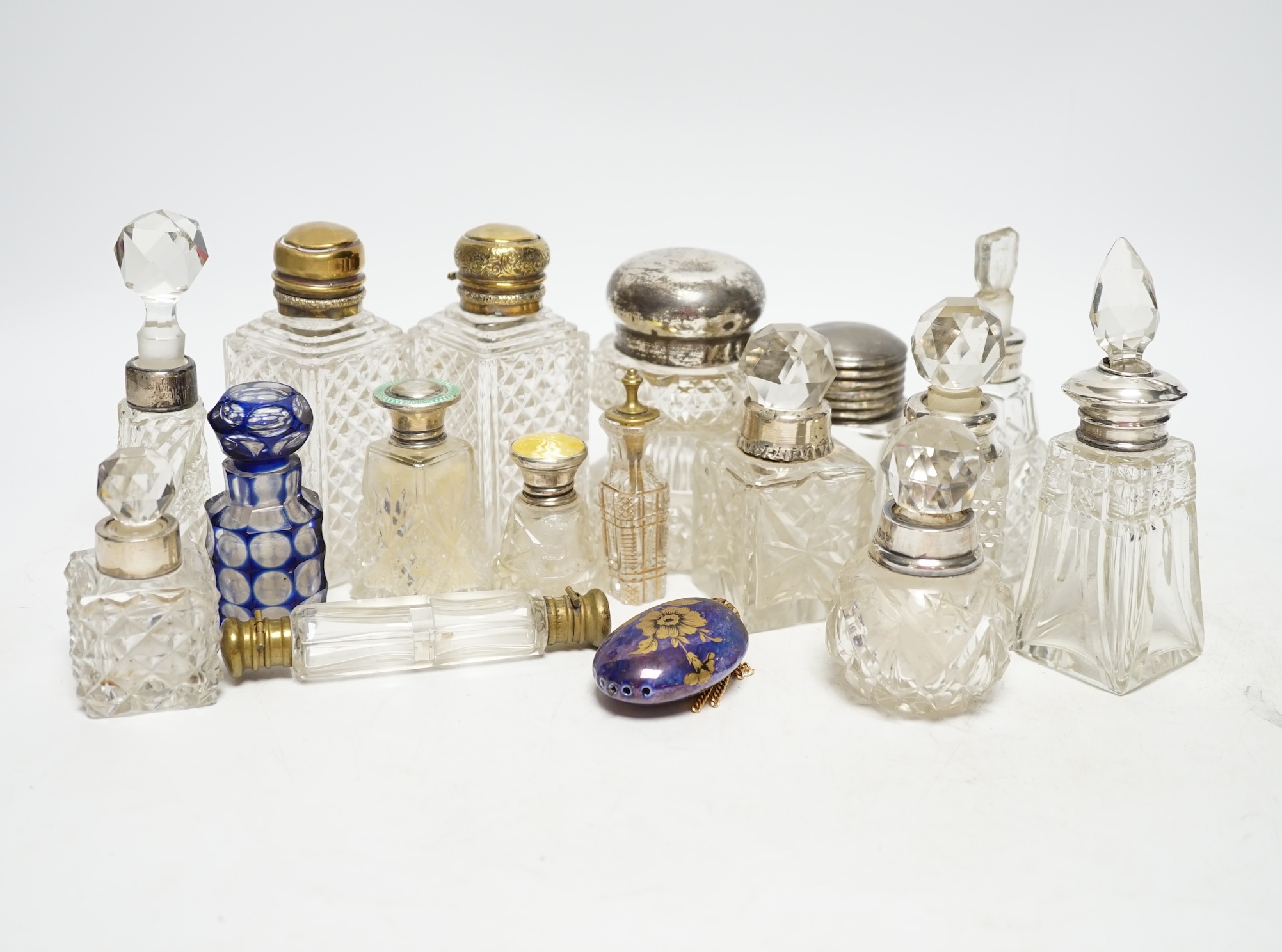 A collection of silver mounted and other perfume bottles